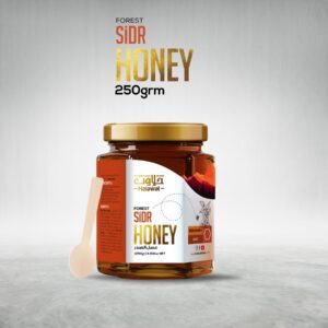 A jar of honey with a wooden honey dipper